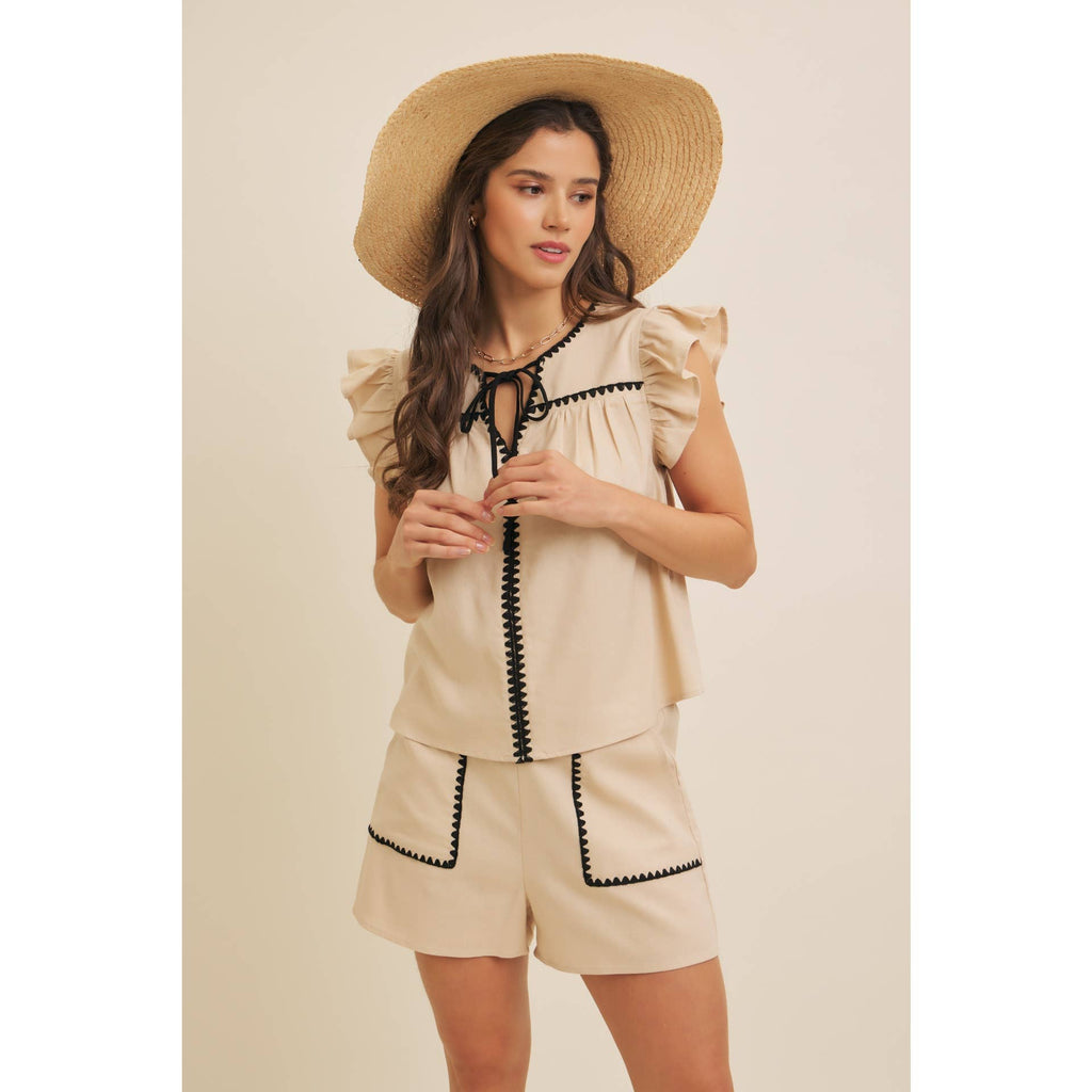 STITCHED SERENITY LINEN-BLEND EMBROIDERED SHORTS: NATURAL/BLACK / M