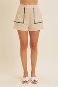 STITCHED SERENITY LINEN-BLEND EMBROIDERED SHORTS: NATURAL/BLACK / L