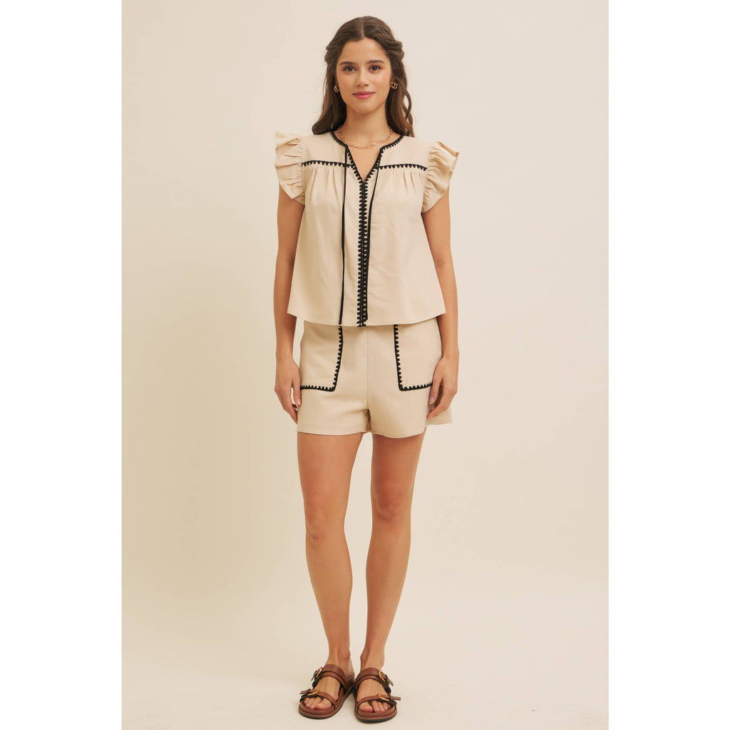 STITCHED SERENITY LINEN-BLEND EMBROIDERED SHORTS: NATURAL/BLACK / L
